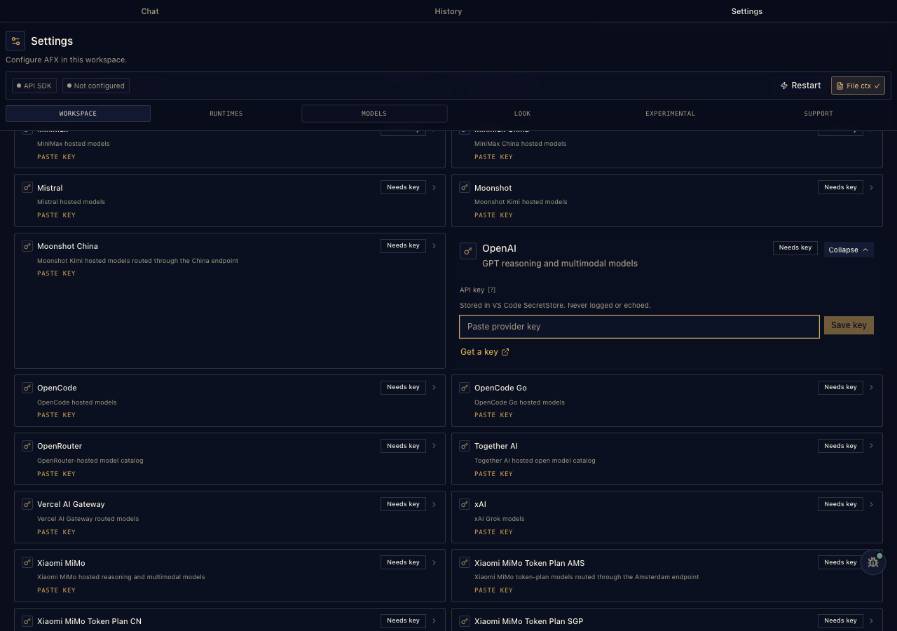 Entering an API key in provider settings, stored in VS Code SecretStorage